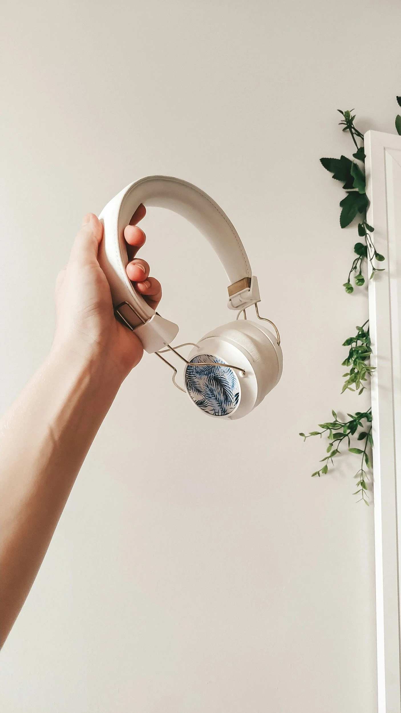 Hand holding headphones a quiet moment of stillness